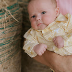 Sunshine lemon long sleeve romper collar detail showing neat neckline finish in lemon