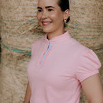 KK pink ruffled collar women's polo shirt ruffle collar detail showing beautiful pink ruffle neckline