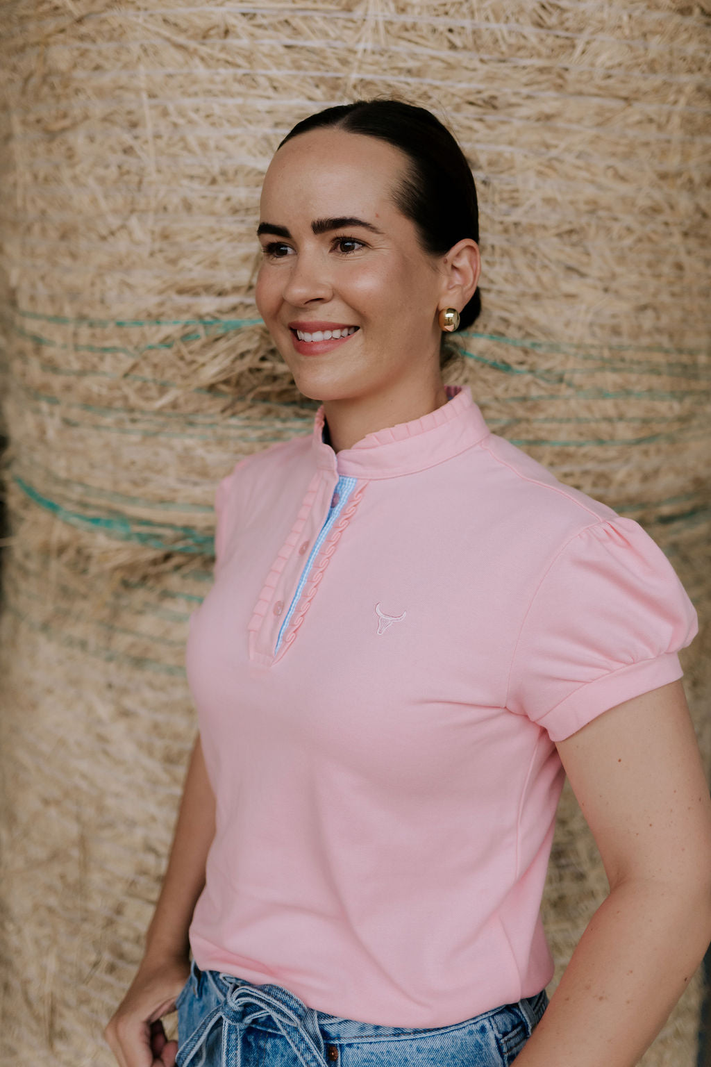 KK pink ruffled collar women's polo shirt ruffle collar detail showing beautiful pink ruffle neckline