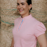 KK pink ruffled collar women's polo shirt ruffle collar detail showing beautiful pink ruffle neckline