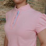 KK pink ruffled collar women's polo shirt back view showing relaxed women's fit in pink
