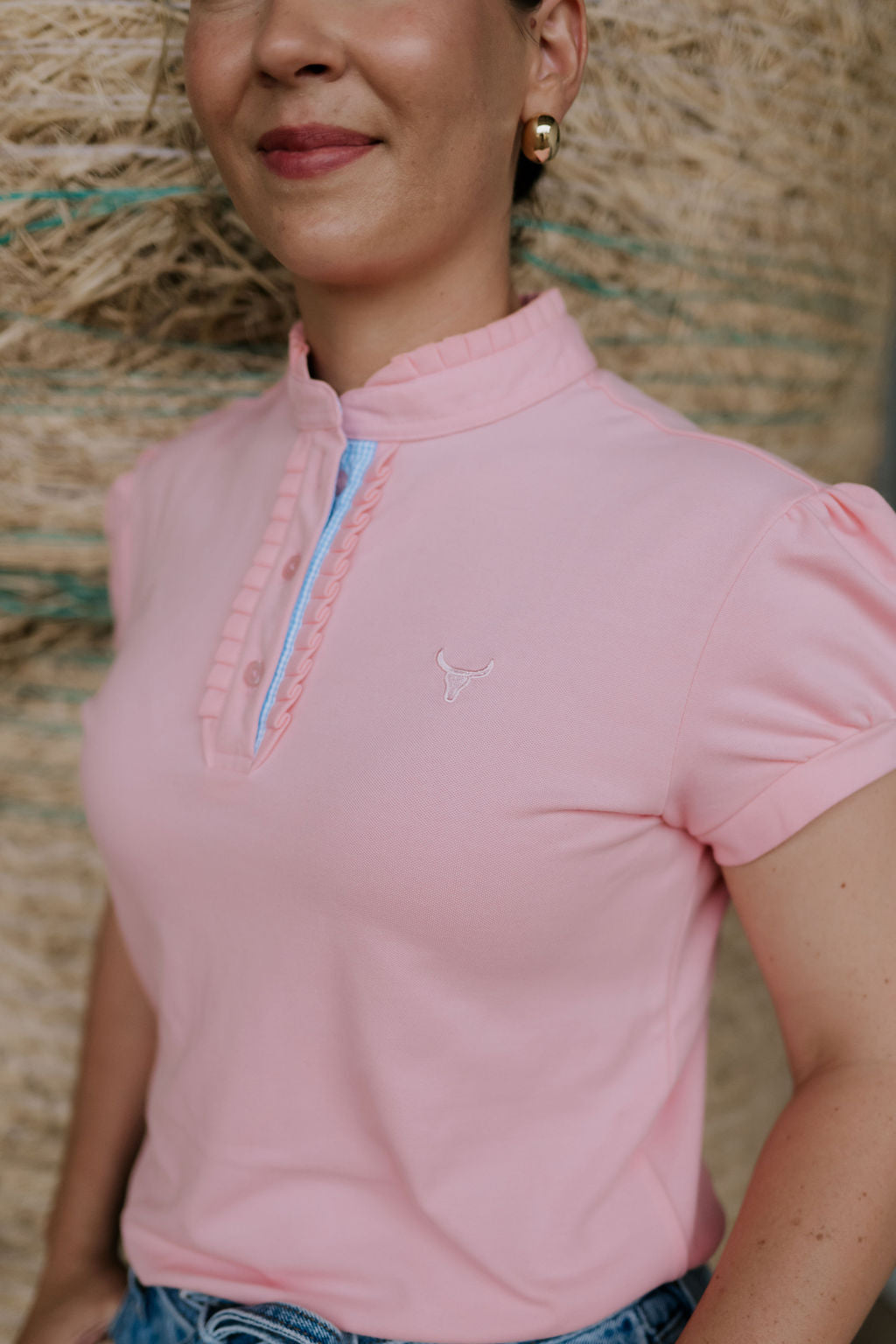 KK pink ruffled collar women's polo shirt back view showing relaxed women's fit in pink