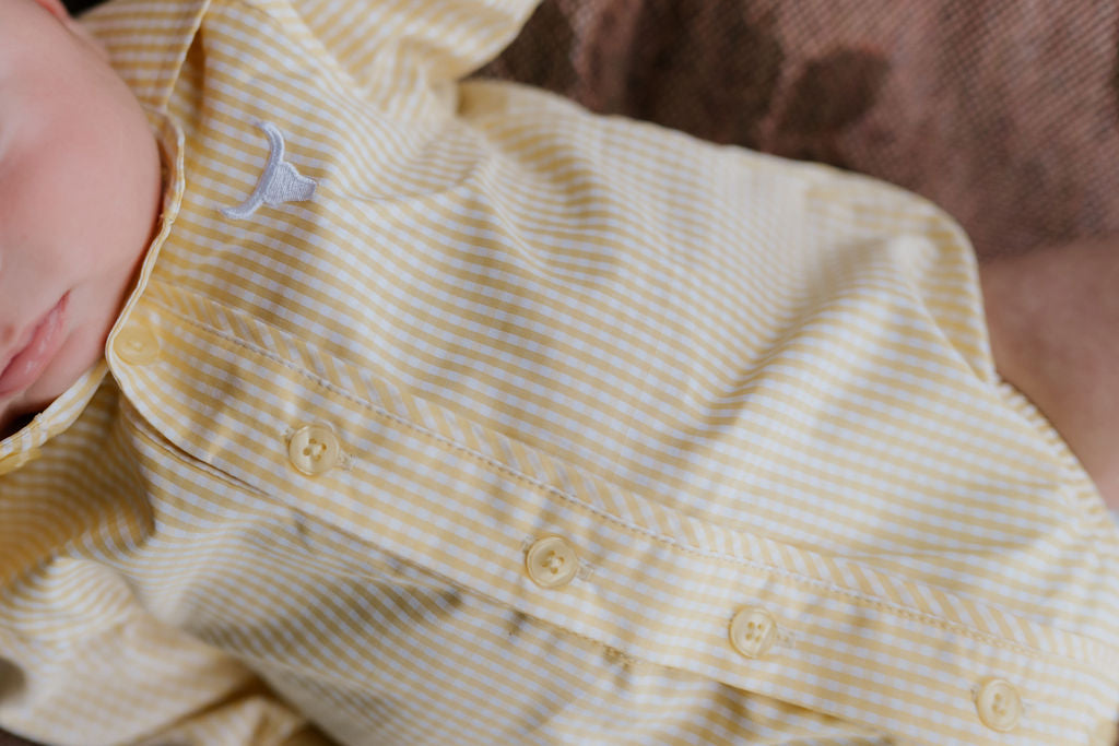 Sunshine lemon long sleeve romper back view showing snap closure and sunny lemon yellow