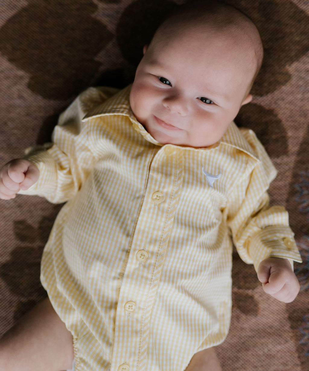 Sunshine lemon long sleeve romper worn by toddler showing cheerful lemon yellow country style