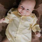 Sunshine lemon long sleeve romper worn by toddler showing cheerful lemon yellow country style
