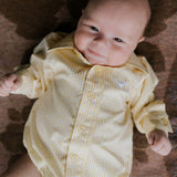 Sunshine lemon long sleeve romper worn by toddler showing cheerful lemon yellow country style