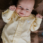 Sunshine lemon long sleeve romper flatlay showing full sunny lemon yellow romper design