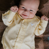 Sunshine lemon long sleeve romper flatlay showing full sunny lemon yellow romper design