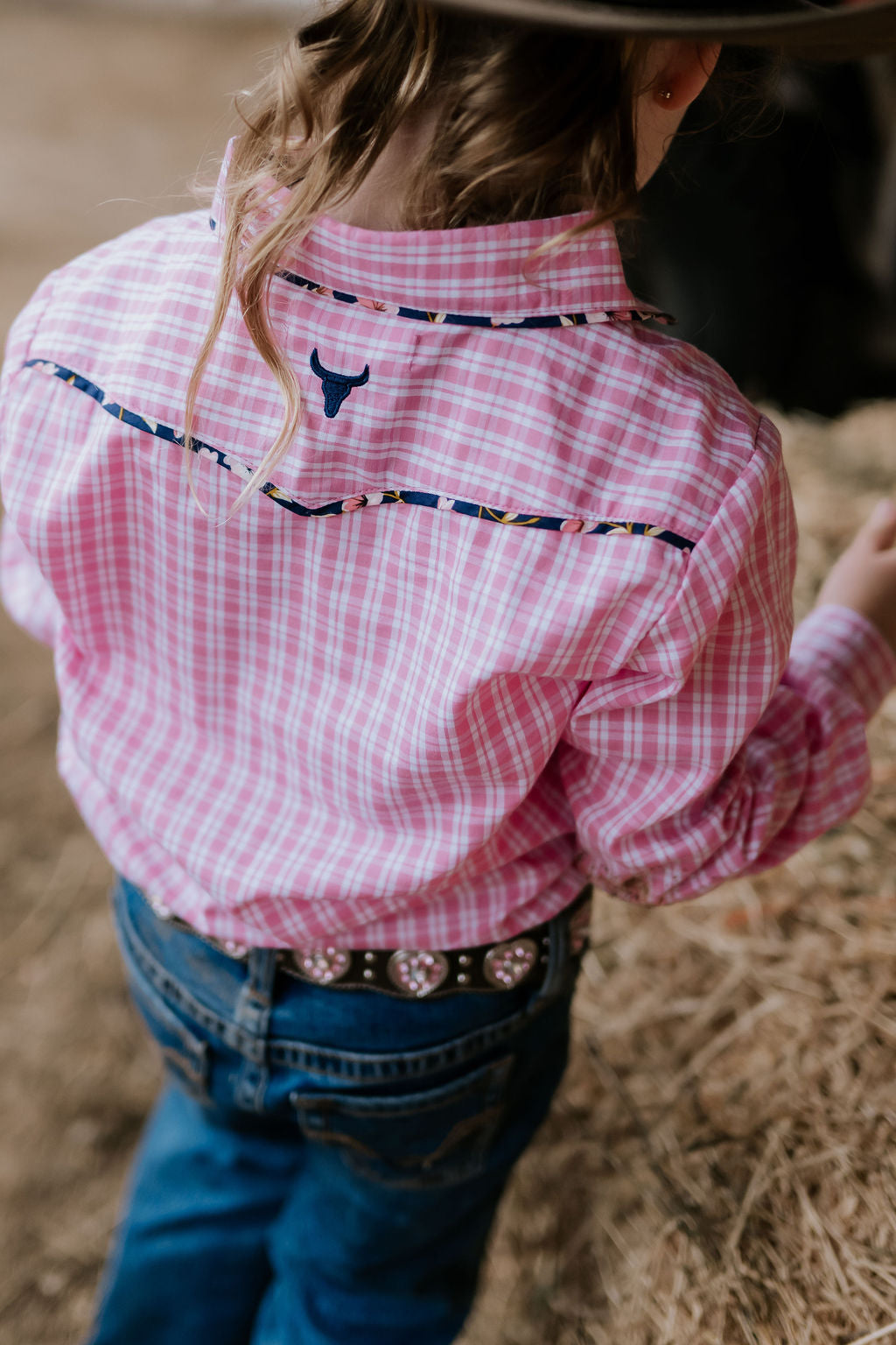 Stella pink check western yoke long sleeve shirt back view showing relaxed women's fit and western yoke