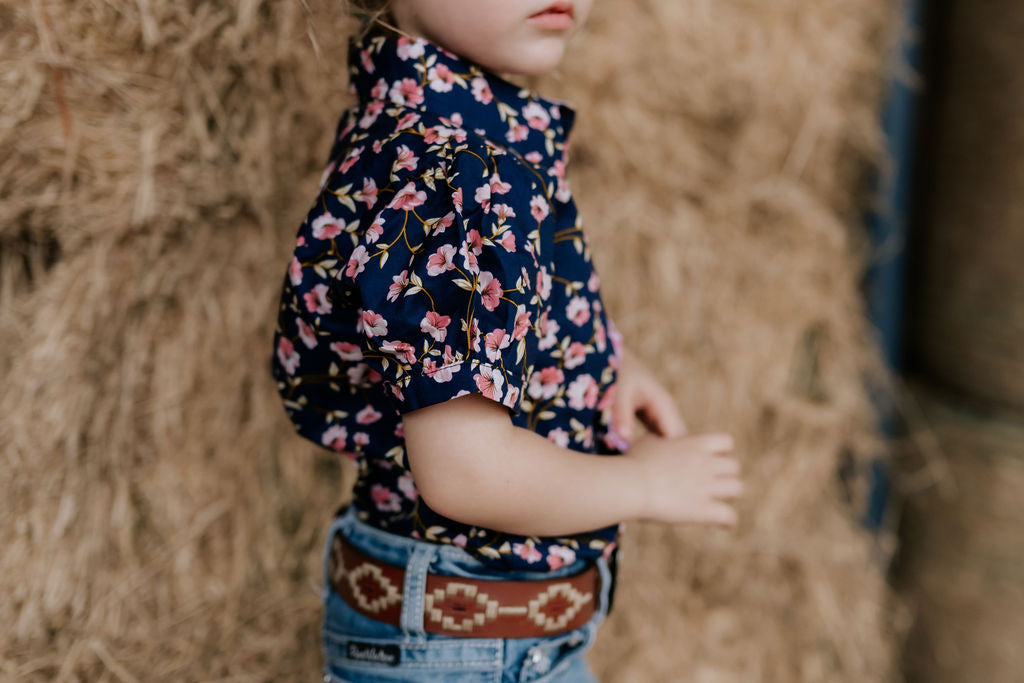 Harlo navy floral short sleeve romper worn showing charming navy floral country style