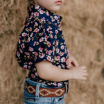 Harlo navy floral short sleeve romper worn showing charming navy floral country style
