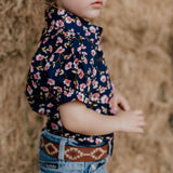 Harlo navy floral short sleeve romper worn showing charming navy floral country style