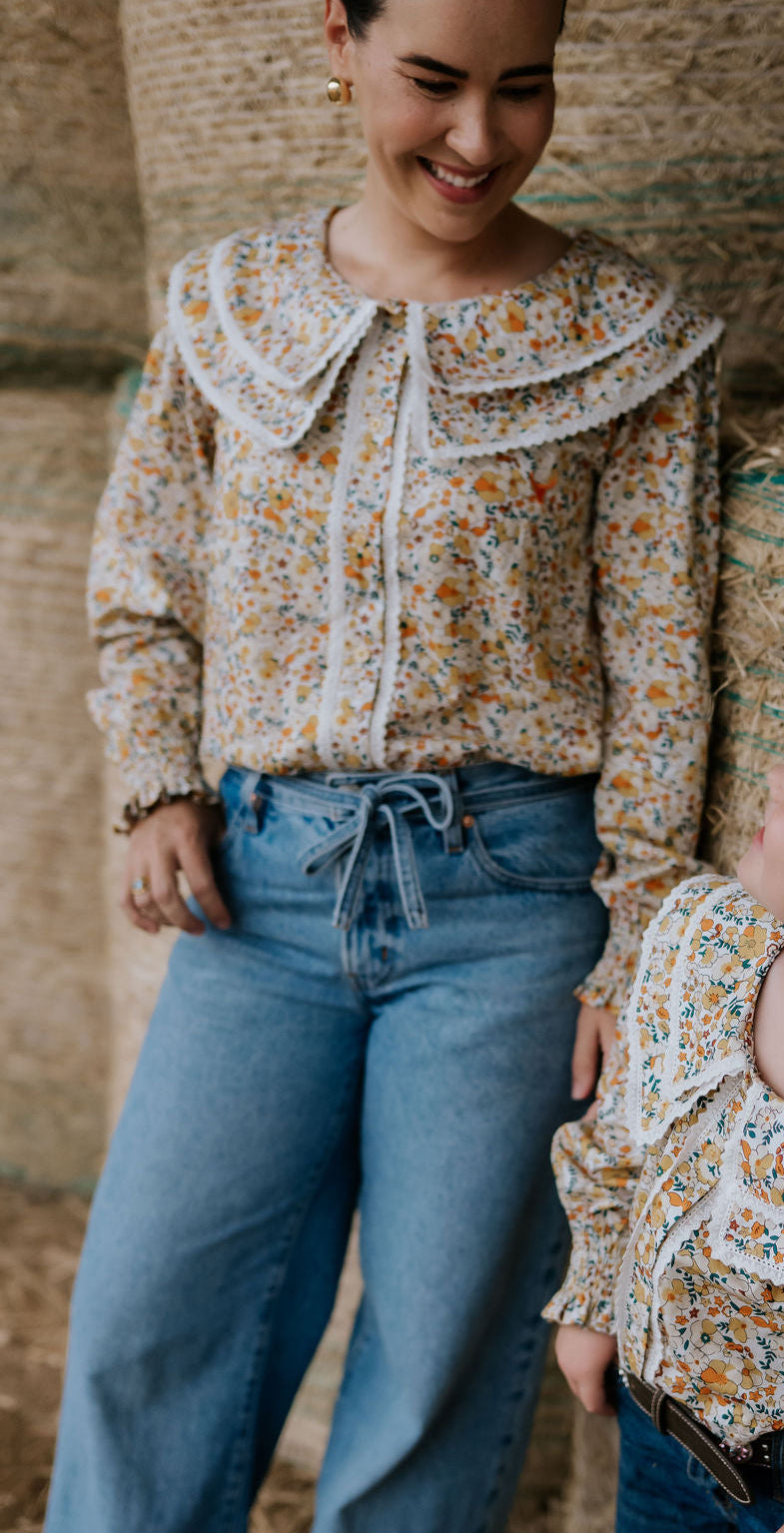 Britt yellow floral women's shirt back view showing relaxed women's fit in yellow floral print