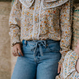 Britt yellow floral women's shirt back view showing relaxed women's fit in yellow floral print