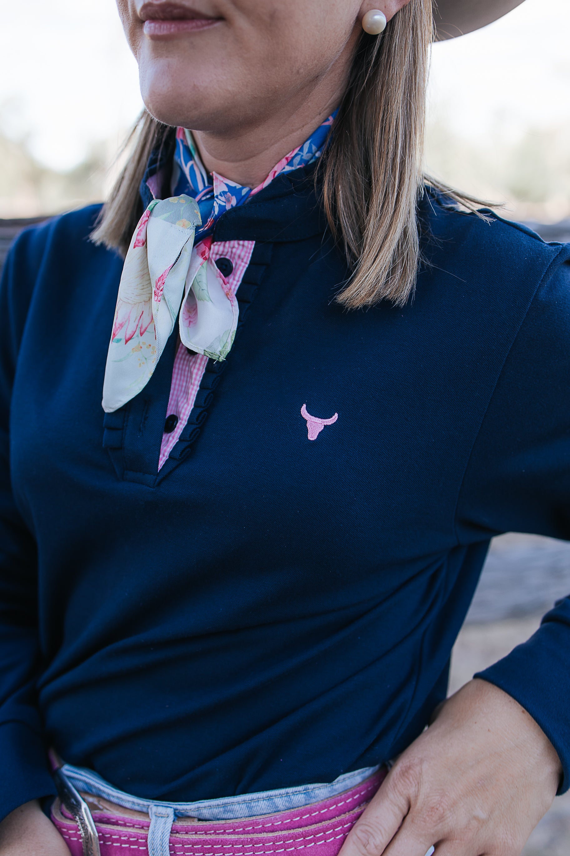 Bella women's long sleeve navy gingham ruffle collar contrast polo back view showing relaxed fit in navy gingham