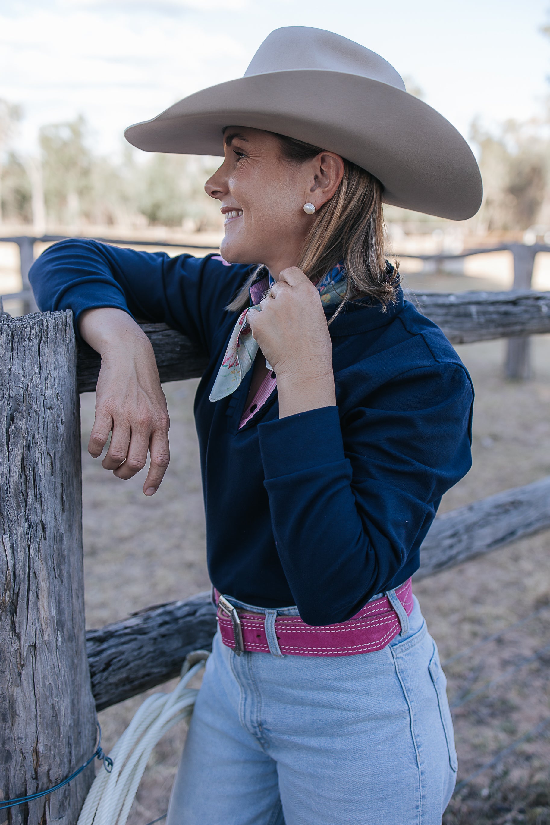Bella women's long sleeve navy gingham ruffle collar contrast polo flatlay showing full navy gingham polo design