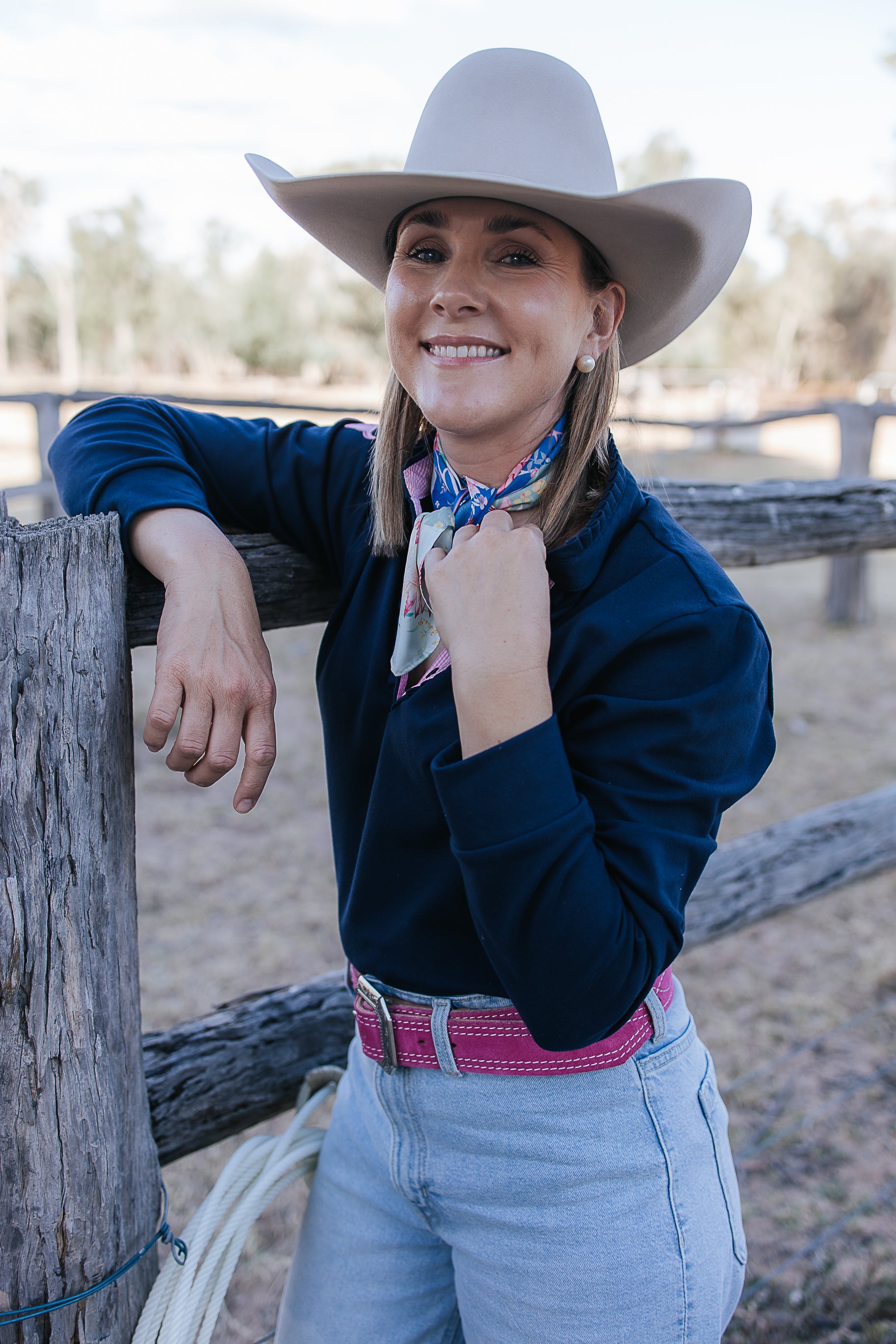 Bella women's long sleeve navy gingham ruffle collar contrast polo fabric close-up showing quality navy gingham cotton