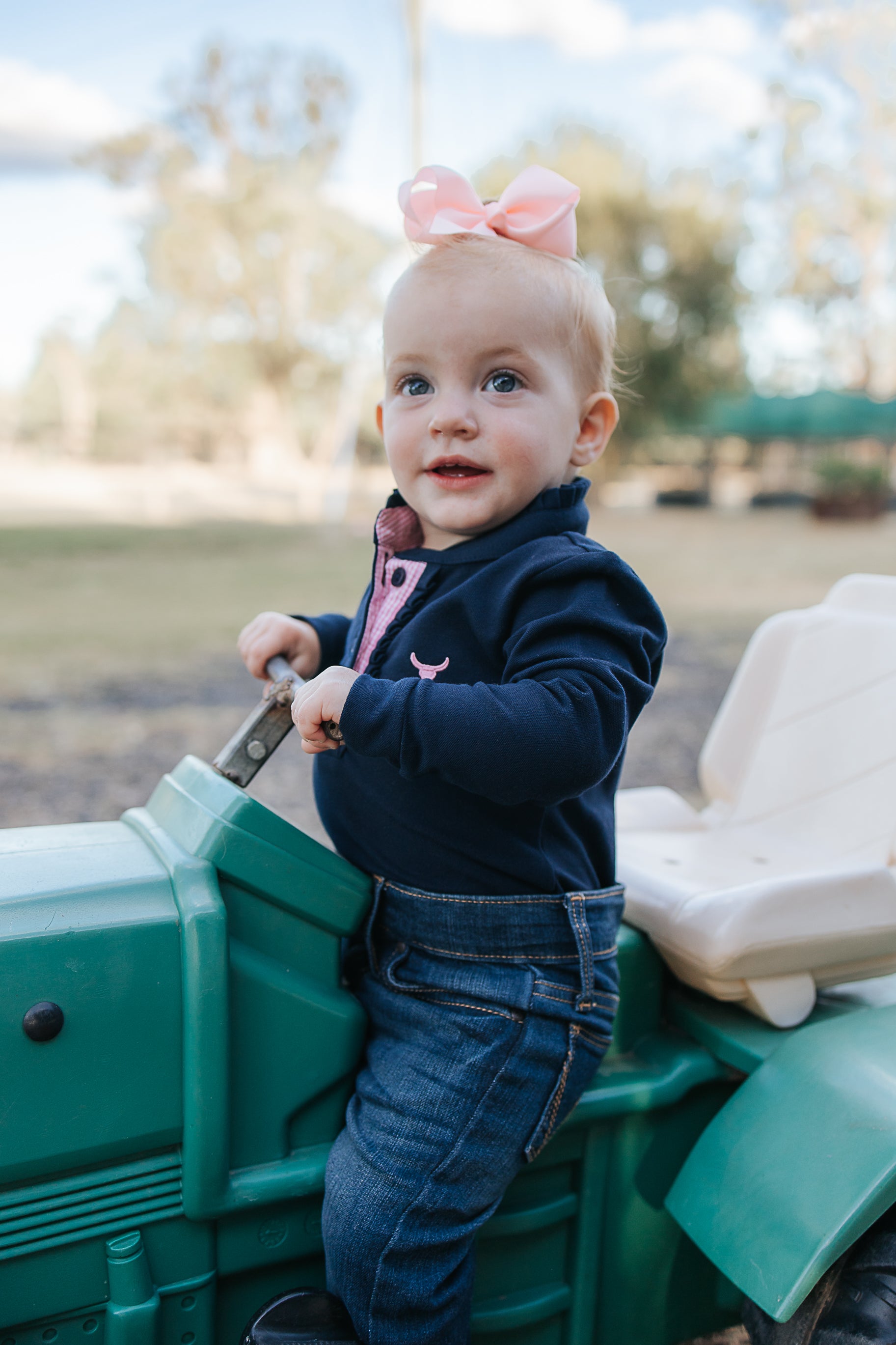 BB Baby navy ruffle pink gingham contrast long sleeve baby polo romper snap detail showing quality press stud closure