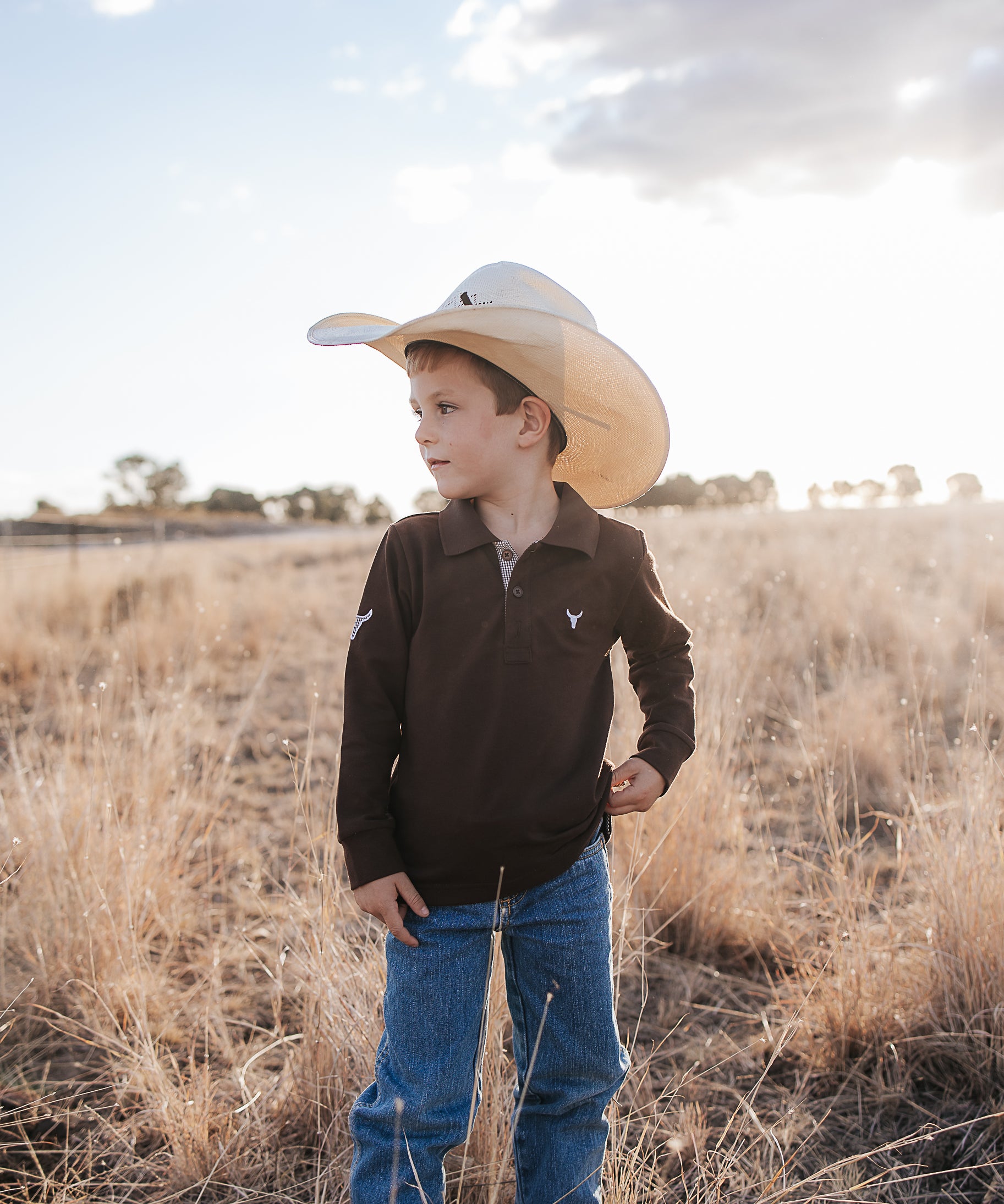 Hanley chocolate gingham contrast long sleeve boy's polo worn showing smart chocolate gingham country style