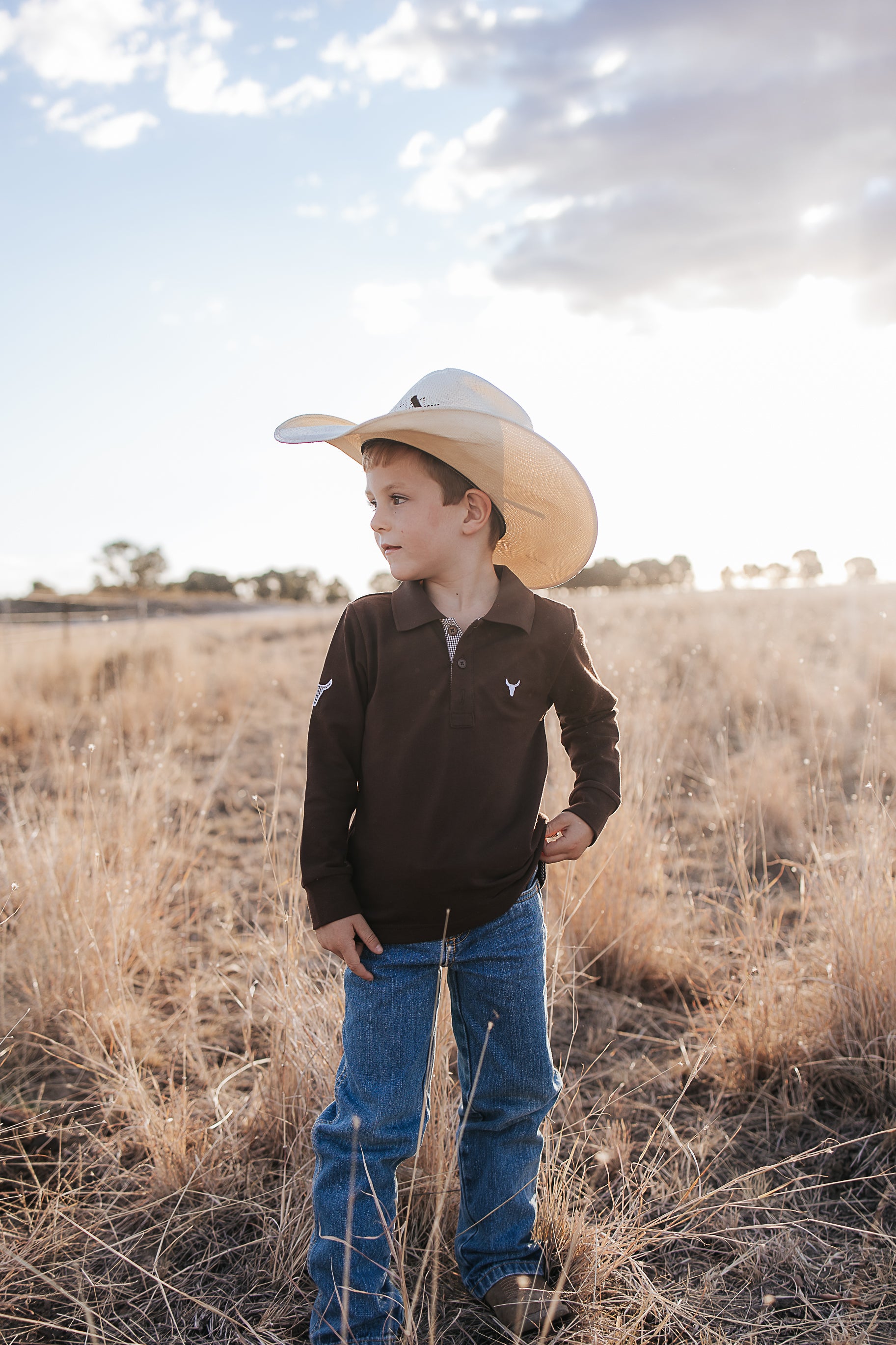 Hanley chocolate gingham contrast long sleeve boy's polo worn showing smart chocolate gingham country style