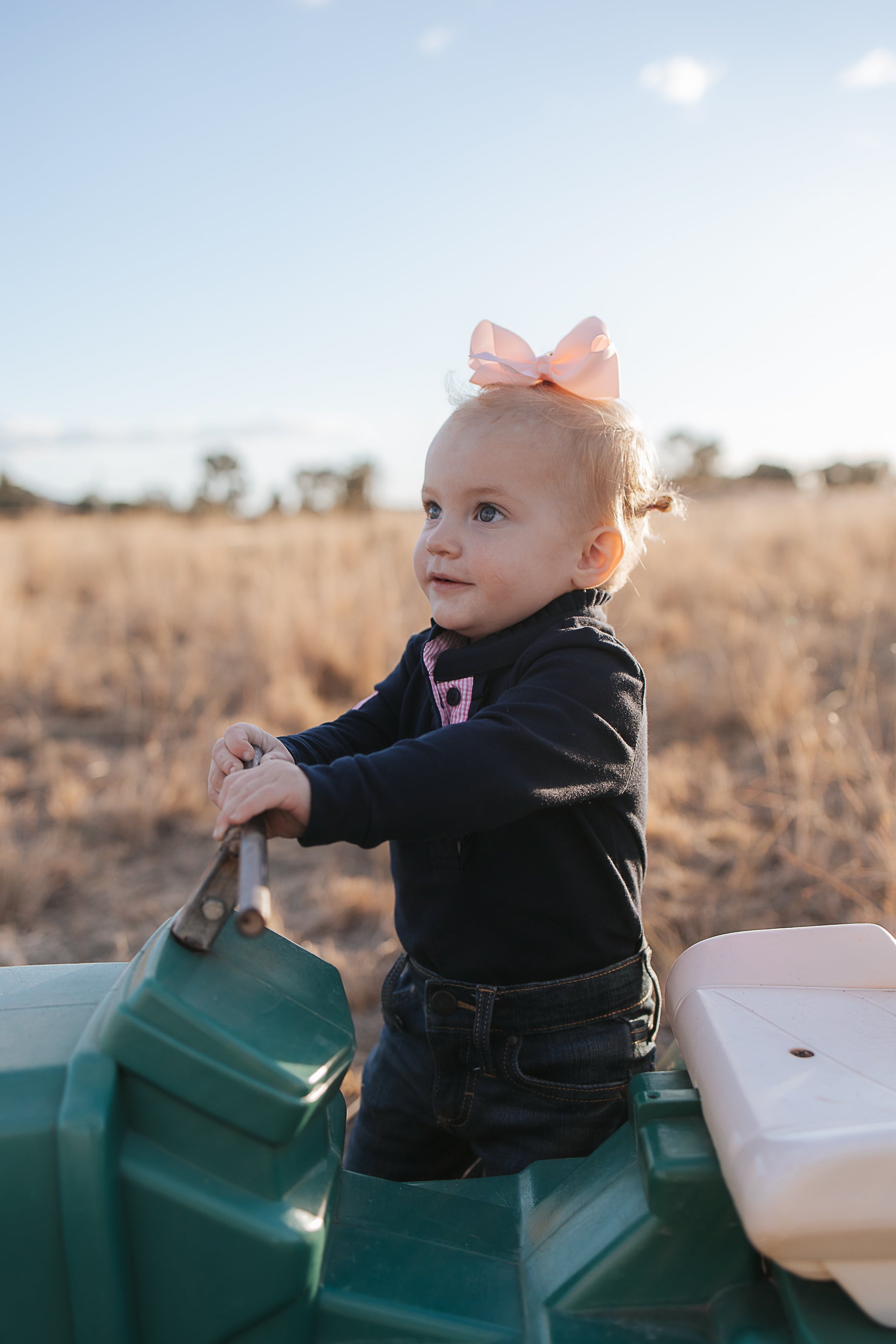BB Baby navy ruffle pink gingham contrast long sleeve baby polo romper worn showing sweet baby navy pink gingham style