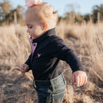 BB Baby navy ruffle pink gingham contrast long sleeve baby polo romper back view showing snap closure and baby fit
