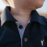 Bandon Jnr navy gingham contrast long sleeve polo back view showing relaxed boys fit in navy gingham
