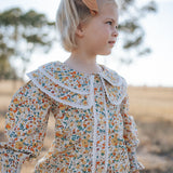 Elsie girls butter yellow floral long sleeve blouse front view showing sweet butter yellow floral blouse for girls