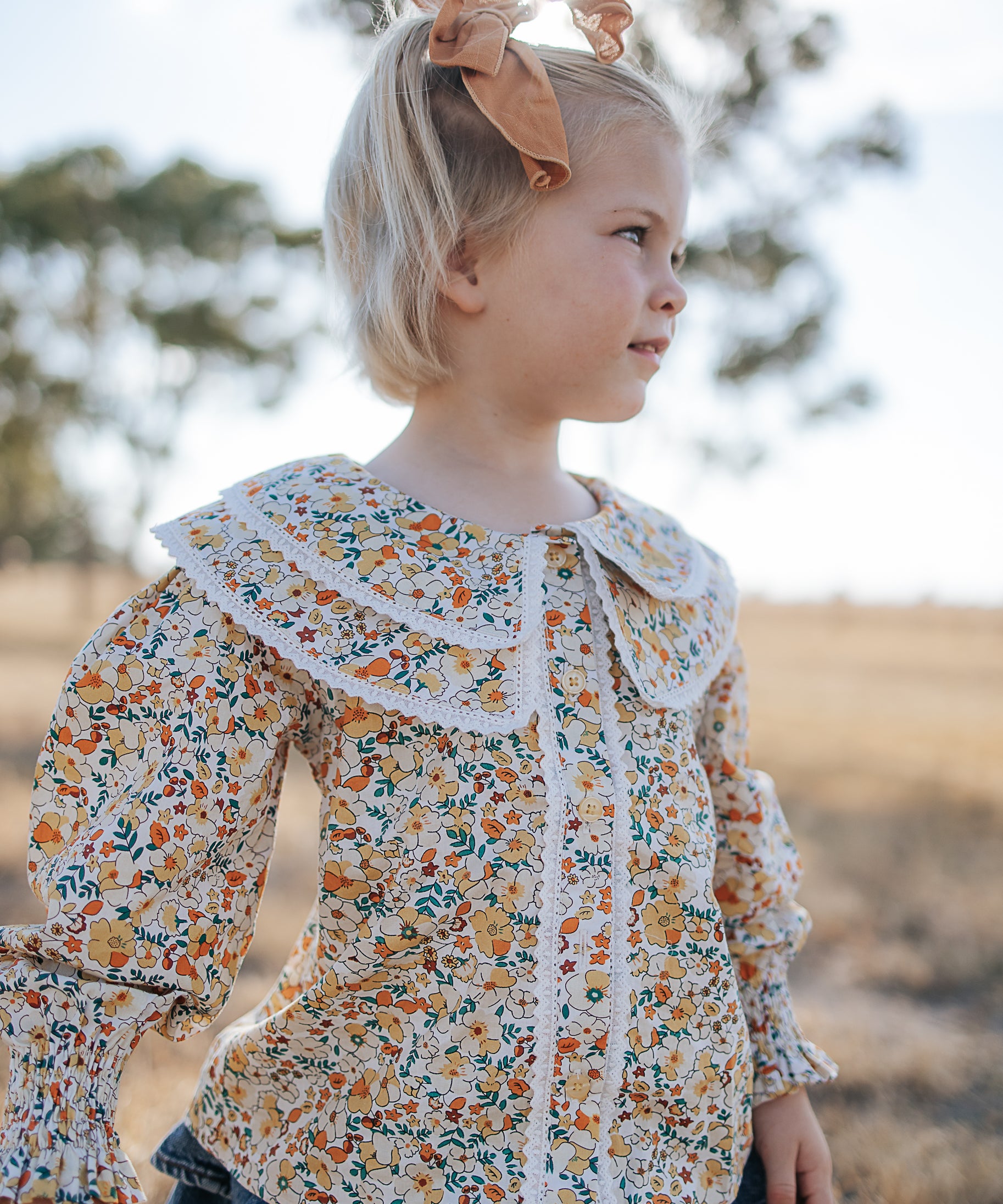 Elsie girls butter yellow floral long sleeve blouse front view showing sweet butter yellow floral blouse for girls