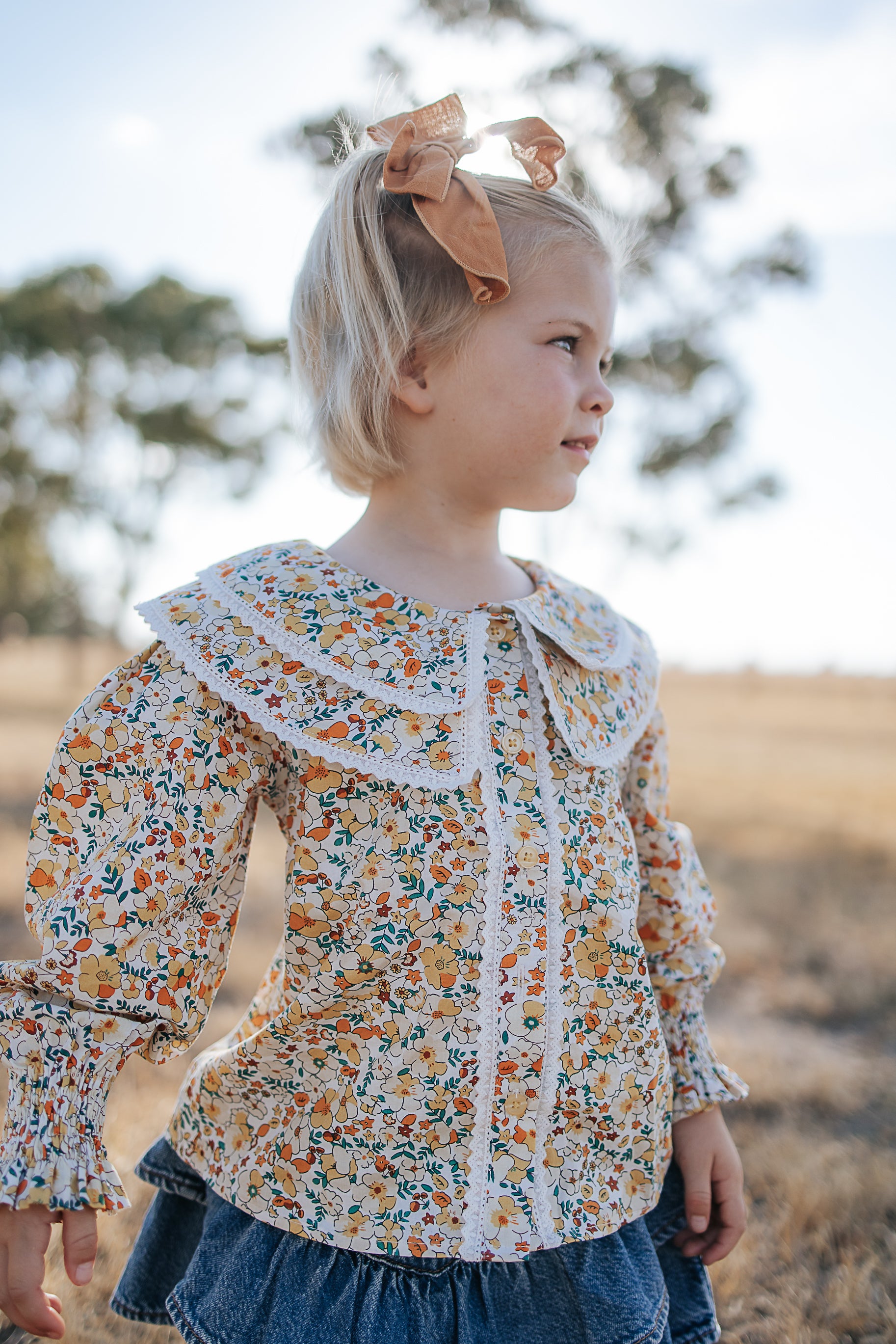 Elsie girls butter yellow floral long sleeve blouse front view showing sweet butter yellow floral blouse for girls