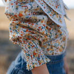 Elsie girls butter yellow floral long sleeve blouse collar detail showing neat collar and button