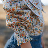 Elsie girls butter yellow floral long sleeve blouse collar detail showing neat collar and button