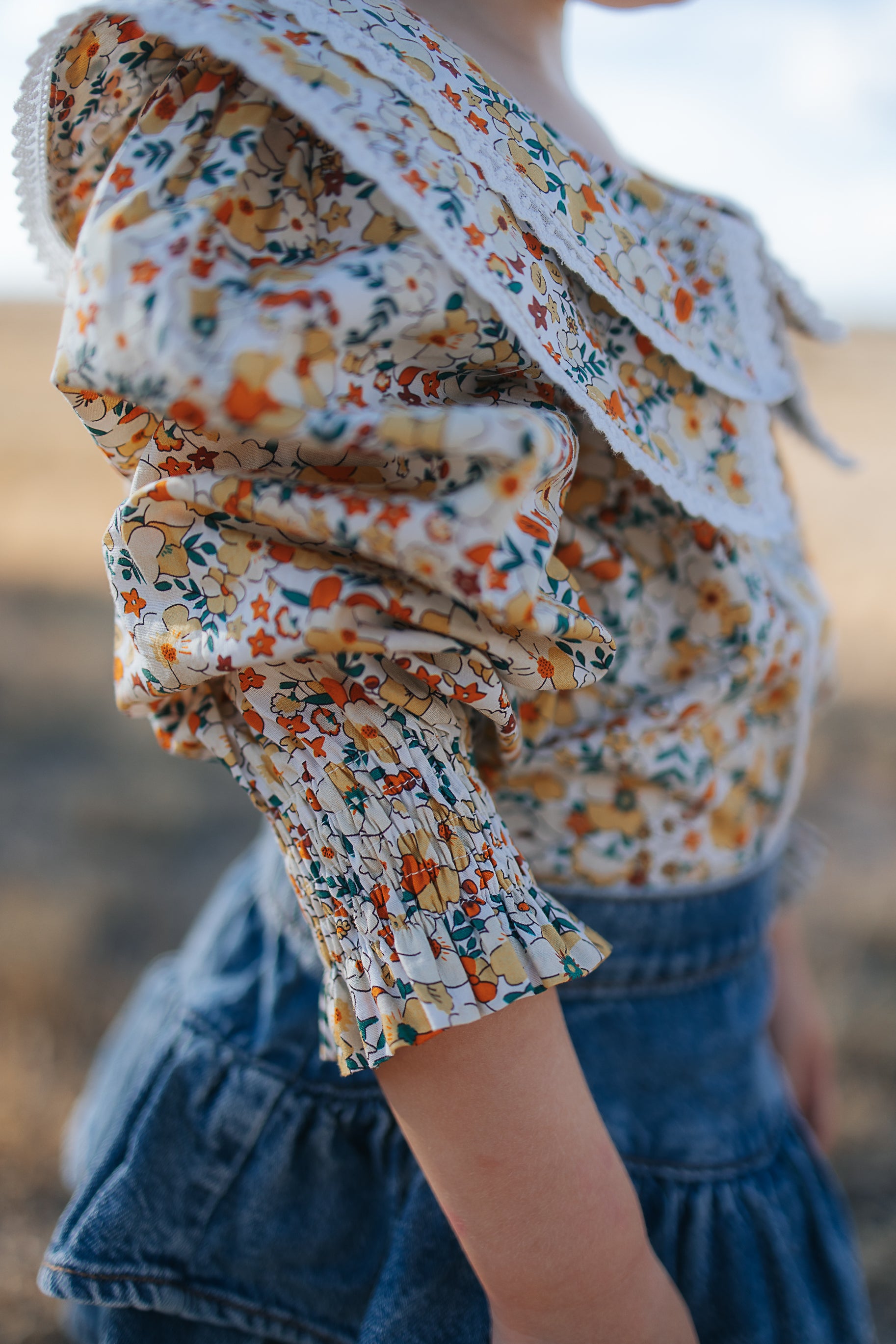 Elsie girls butter yellow floral long sleeve blouse collar detail showing neat collar and button