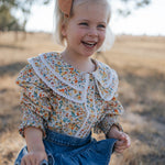 Elsie girls butter yellow floral long sleeve blouse print close-up showing detailed yellow floral pattern