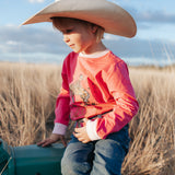 Luna Ride Hard pink long sleeve tee flatlay showing full pink Ride Hard graphic tee design