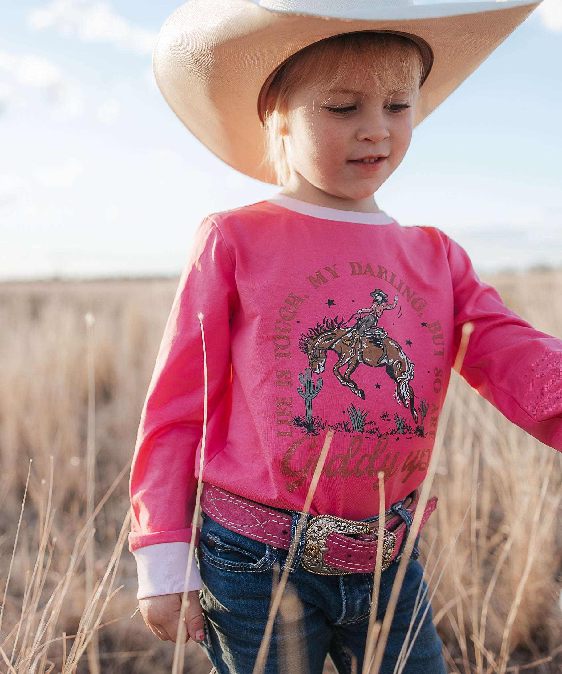 Luna Ride Hard pink long sleeve tee worn showing fun pink country graphic tee style