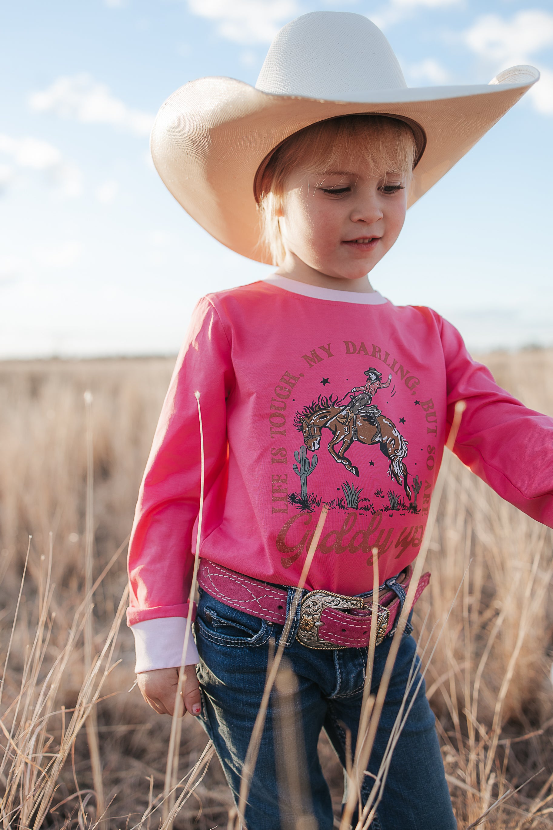 Luna Ride Hard pink long sleeve tee worn showing fun pink country graphic tee style