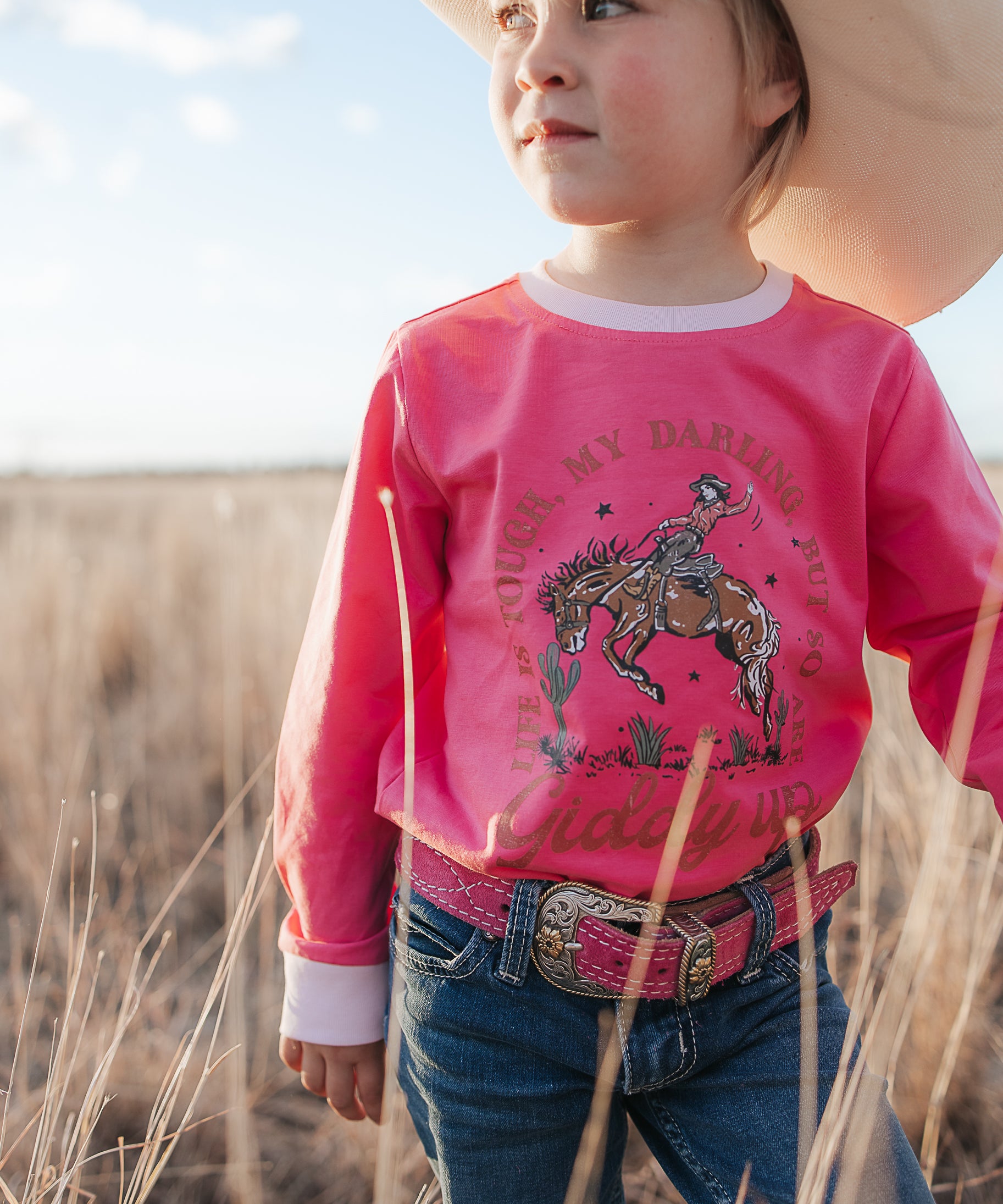 Ride Hard sibling set showing Luna pink long sleeve tee for girls