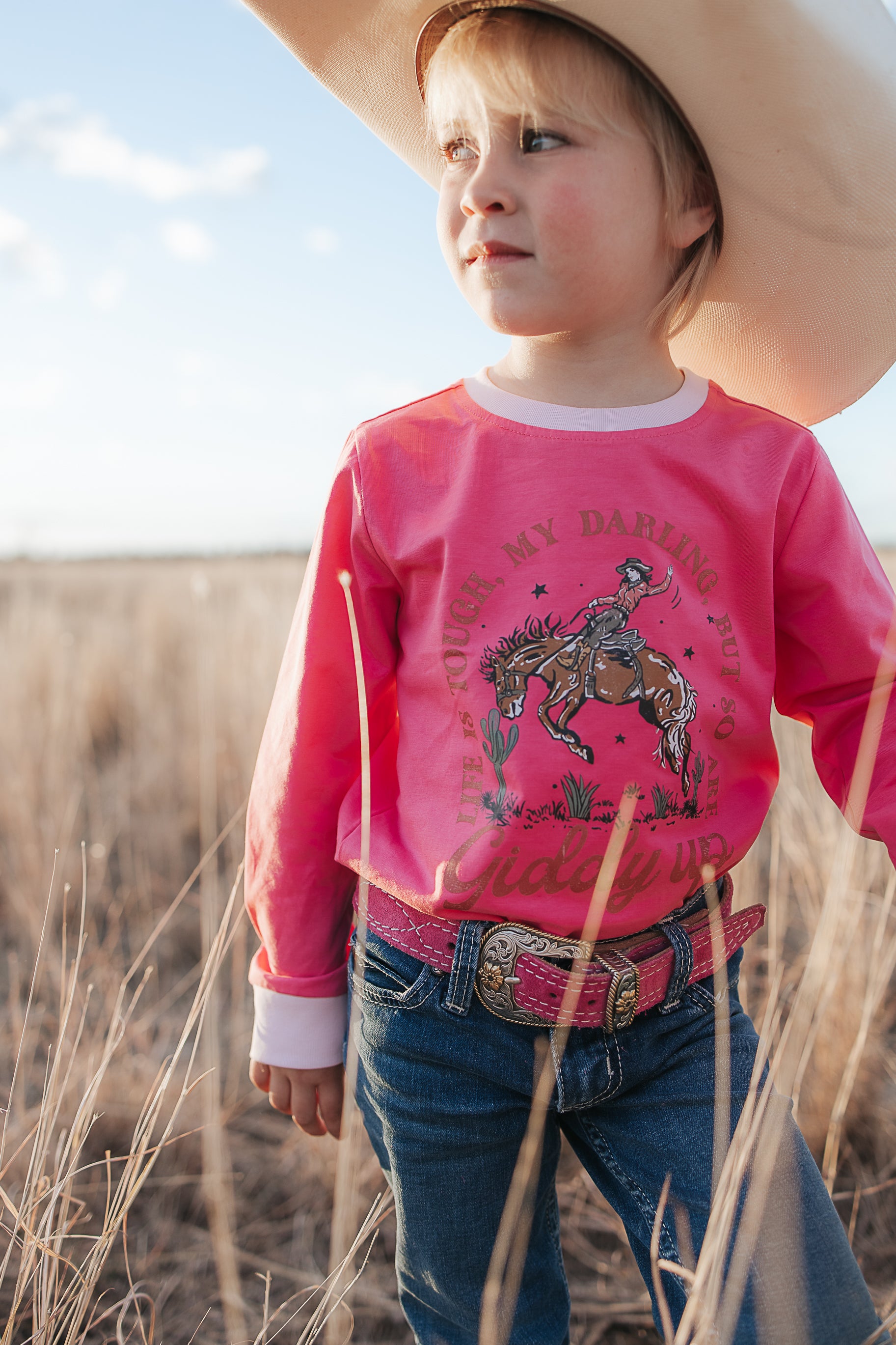Ride Hard sibling set showing Luna pink long sleeve tee for girls