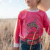 Ride Hard sibling set showing Luna pink long sleeve tee for girls