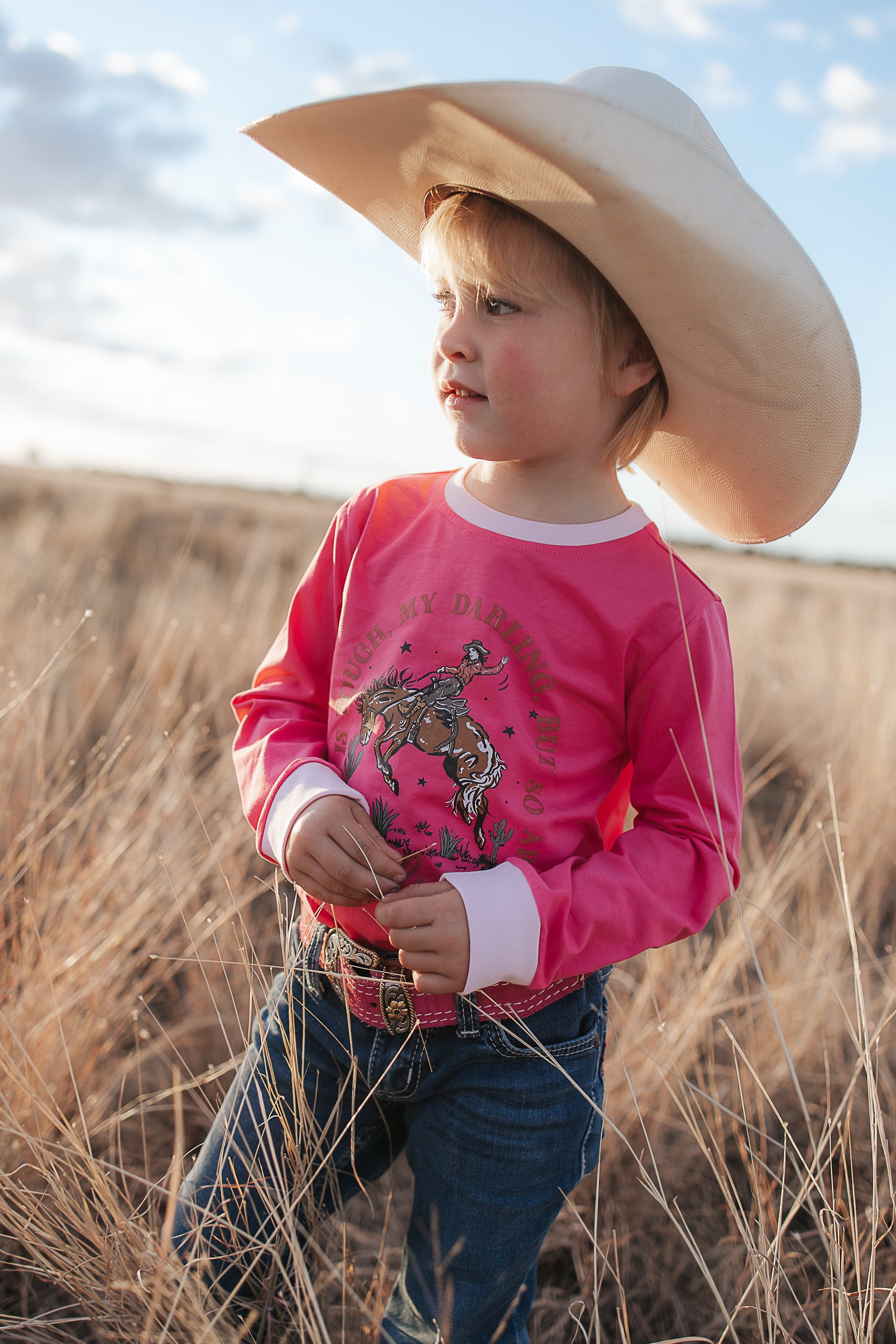 Luna Ride Hard pink long sleeve tee collar detail showing neat neckline on pink graphic tee
