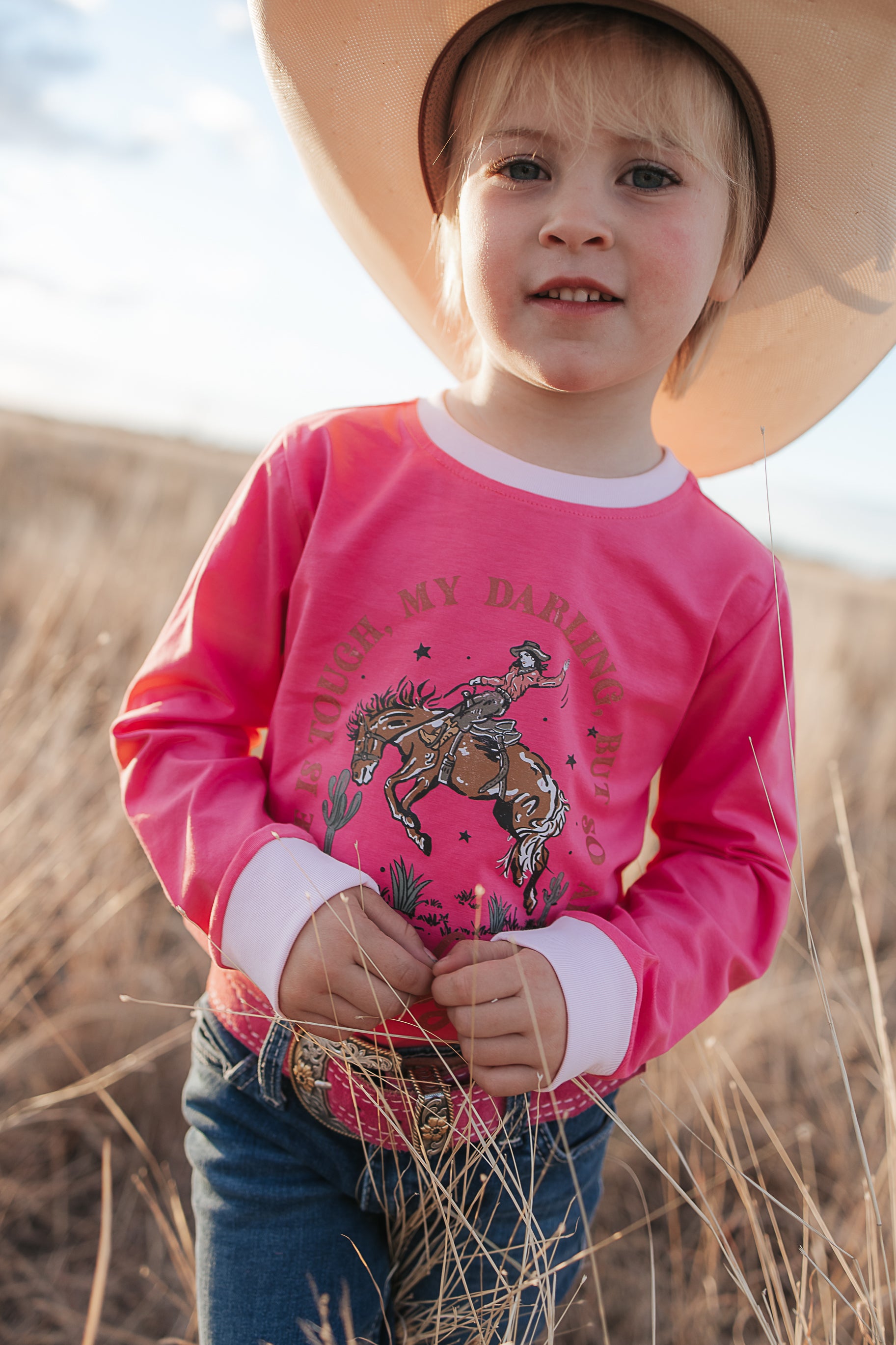 Luna Ride Hard pink long sleeve tee graphic detail showing bold Ride Hard print on pink tee