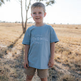 LWCC embroidered kids tee powder blue front view showing signature LWCC logo on soft powder blue