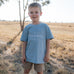 LWCC embroidered kids tee powder blue front view showing signature LWCC logo on soft powder blue