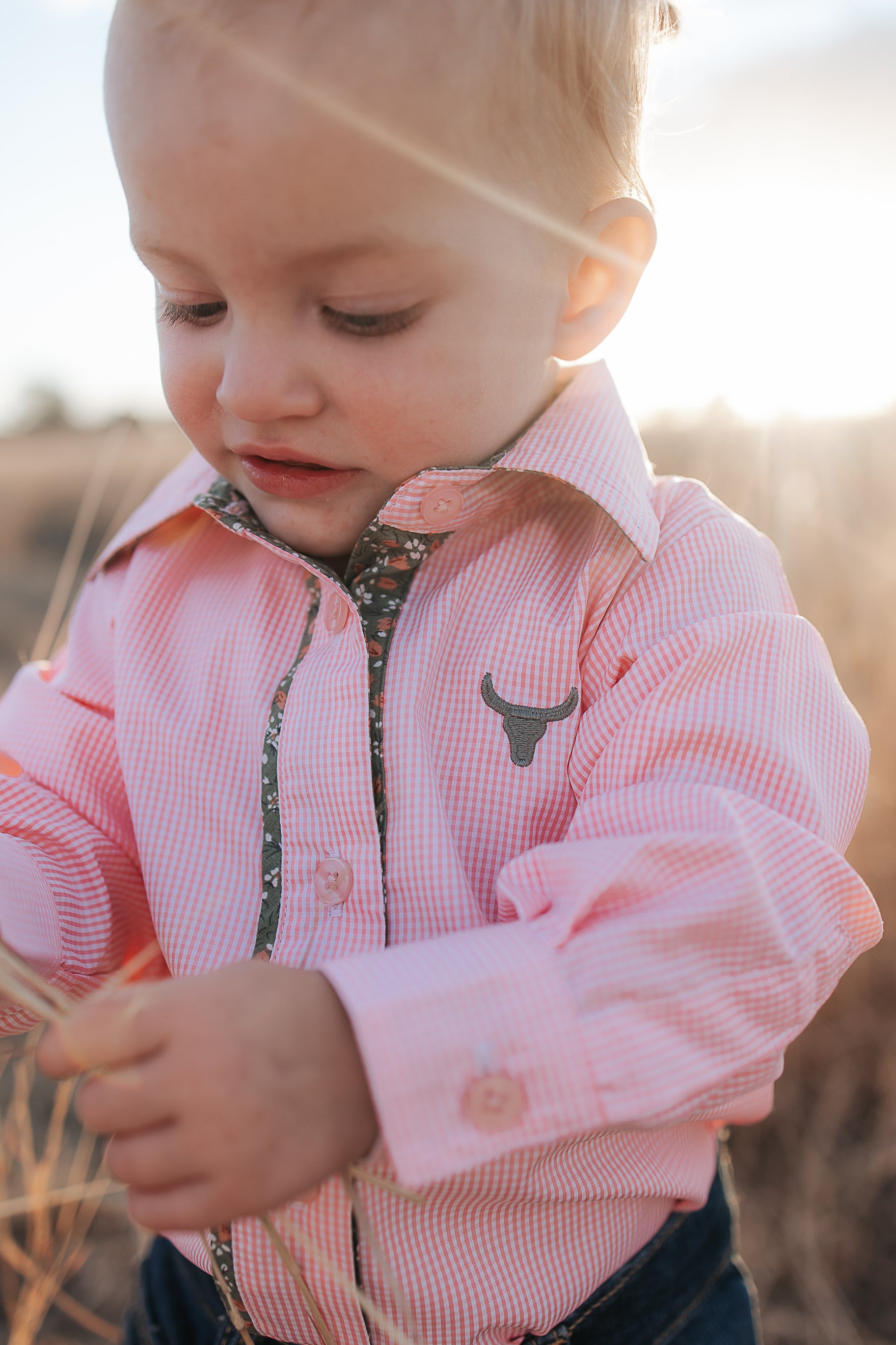 Chloe coral gingham long sleeve romper flatlay showing full coral check romper design