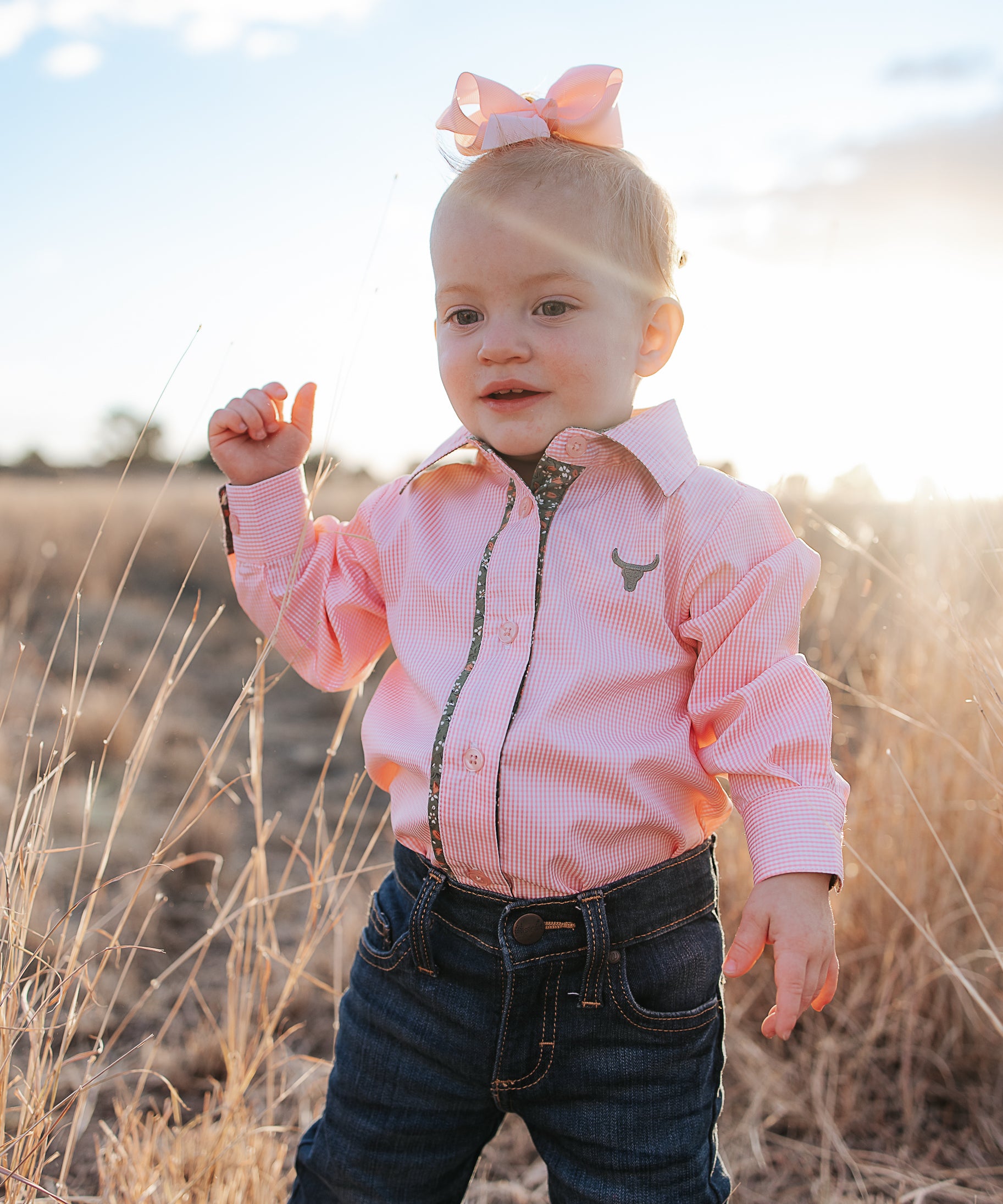 Chloe coral gingham long sleeve romper front view showing sweet coral gingham check romper for toddlers