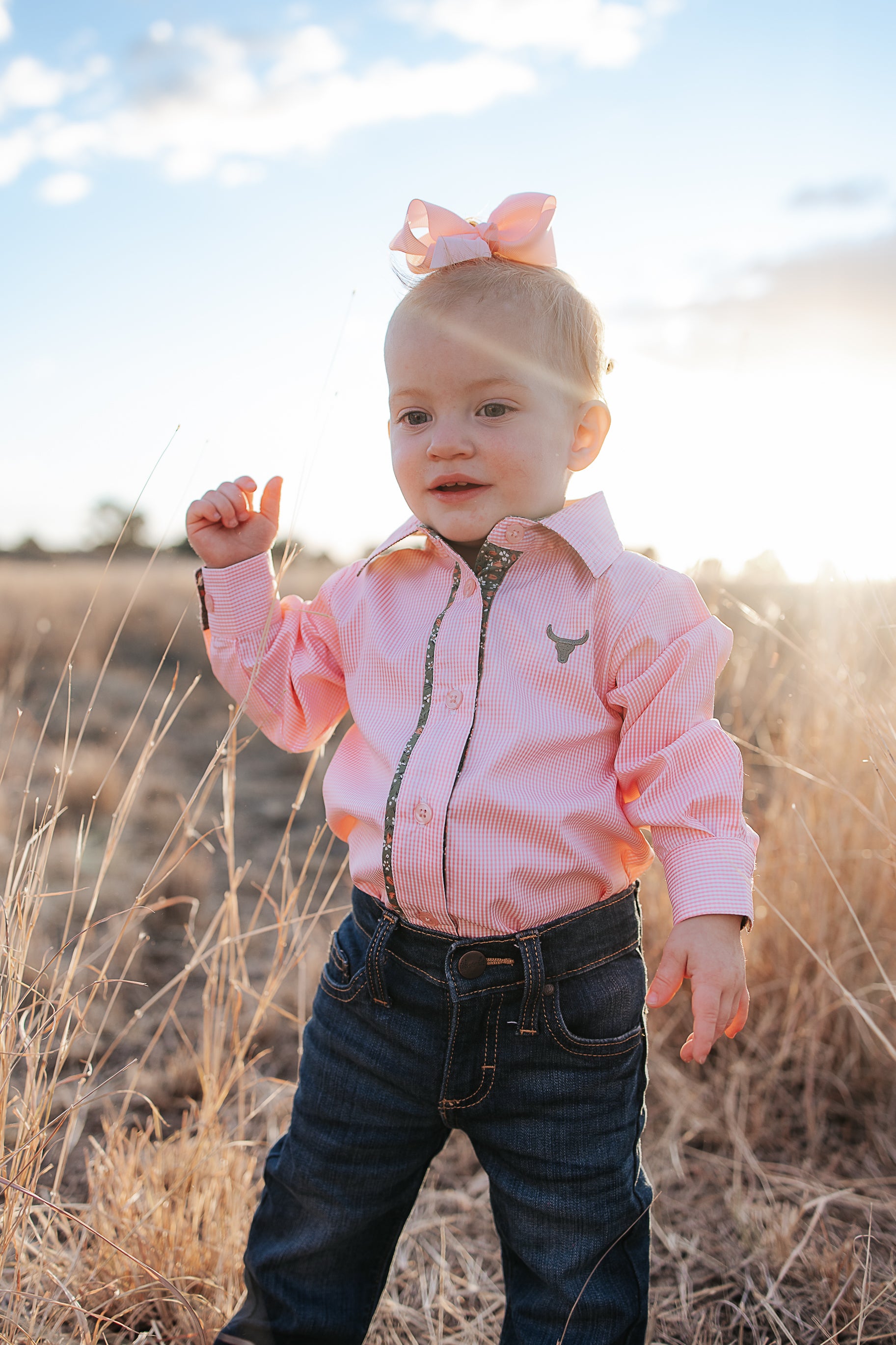 Chloe coral gingham long sleeve romper front view showing sweet coral gingham check romper for toddlers