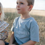 LWCC embroidered kids tee powder blue hem detail showing quality finish