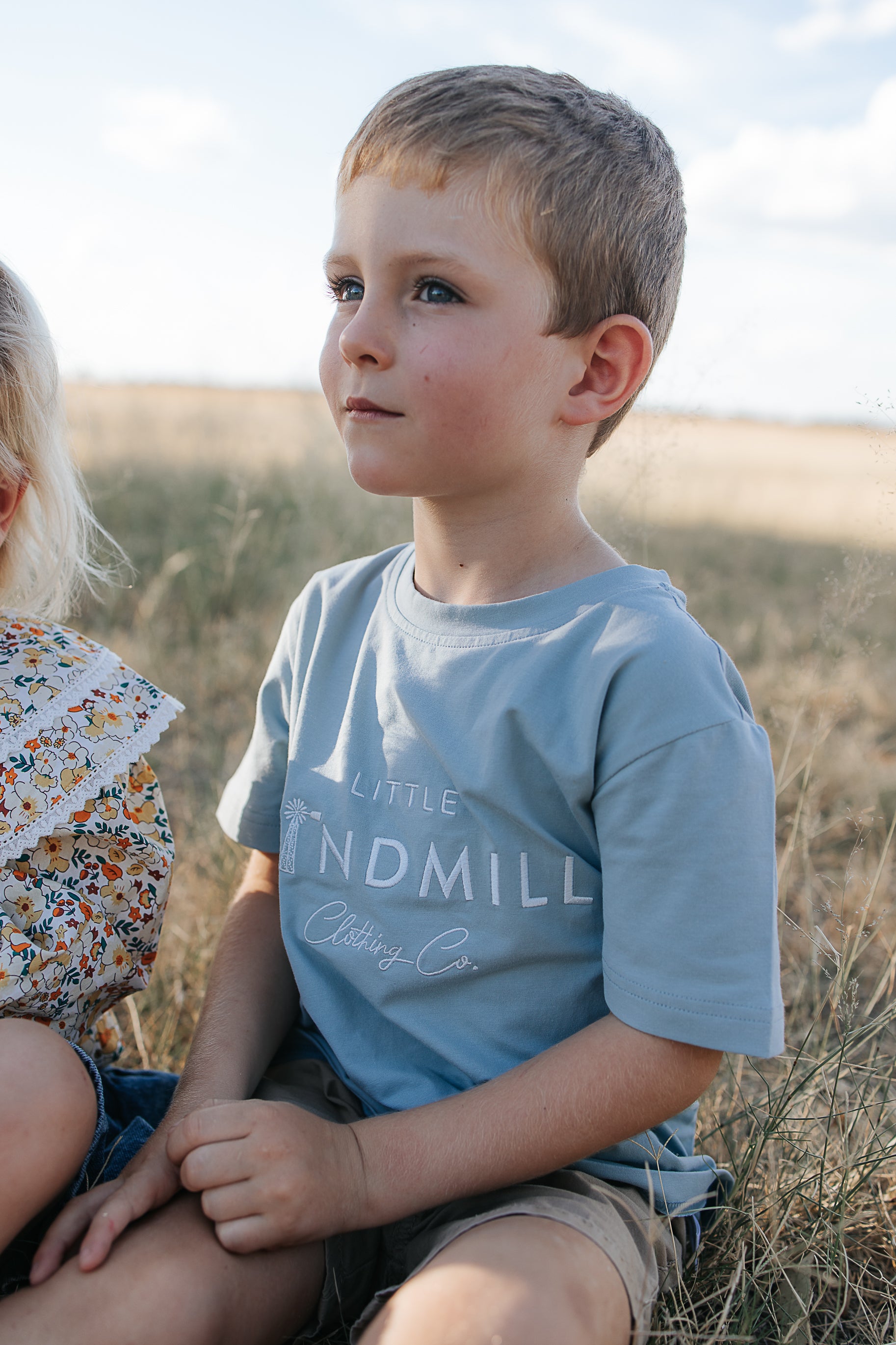 LWCC embroidered kids tee powder blue hem detail showing quality finish