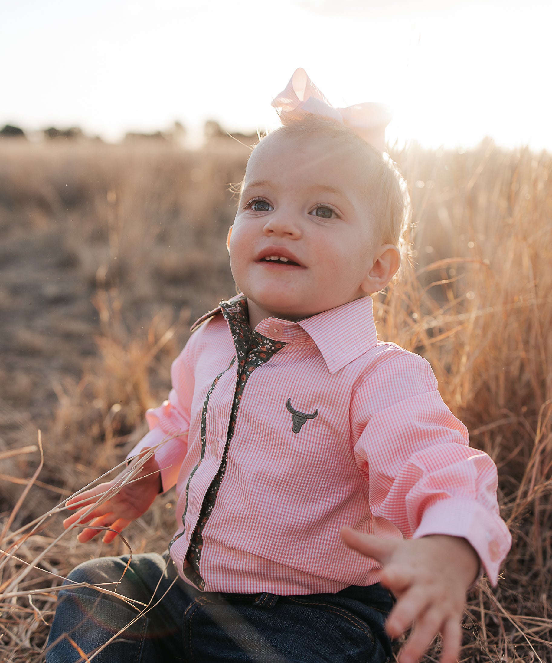 Chloe coral gingham long sleeve romper worn by toddler showing adorable coral gingham country style